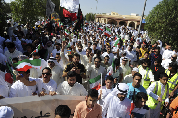 Thousands of Sunnis and Shiites from across the country take part in a mass funeral procession for 27 people killed in a suicide bombing that targeted the Shiite Imam Sadiq Mosque (Photo: AP) Thousands of Sunnis and Shiites from across the country take part in a mass funeral procession for 27 people killed in a suicide bombing that targeted the Shiite Imam Sadiq Mosque (Photo: AP)